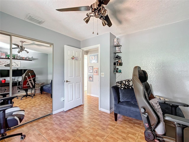 1072 SE 155th St, Summerfield, FL 34491 - home office with visible vents, a textured ceiling, ceiling fan, and baseboards