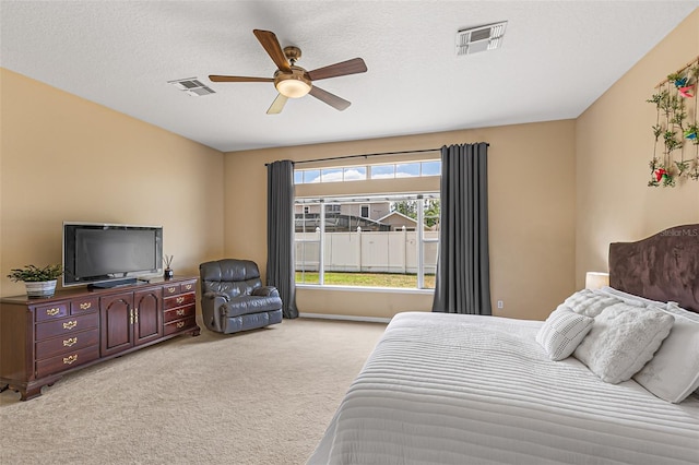 bedroom with ceiling fan, carpet, and visible vents