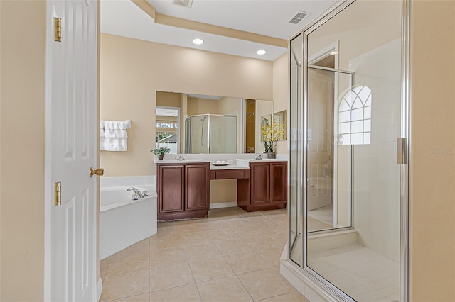 full bathroom featuring vanity, tile patterned floors, visible vents, a bath, and a stall shower