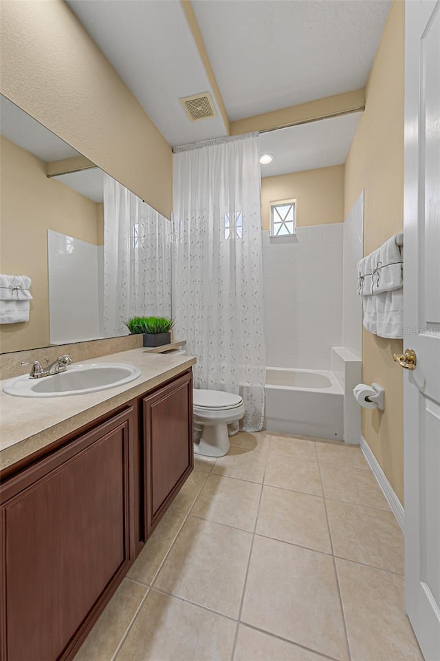bathroom featuring visible vents, shower / bath combo with shower curtain, vanity, toilet, and tile patterned floors