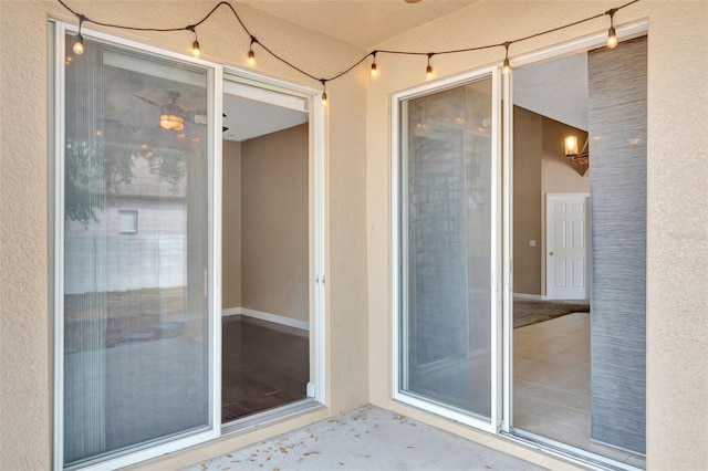entrance to property with stucco siding