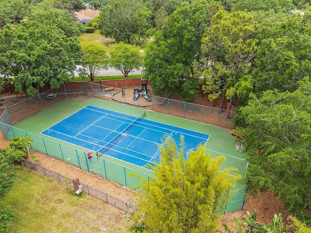 view of tennis court with fence
