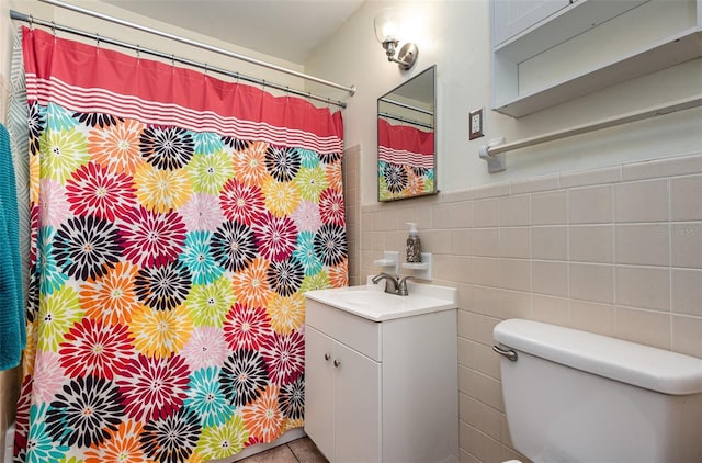 full bath featuring vanity, toilet, tile walls, and a shower with shower curtain