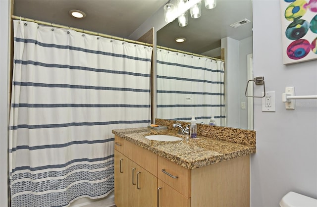 155 S Court Ave Unit 1305, Orlando, FL 32801 - bathroom with vanity, recessed lighting, curtained shower, and visible vents