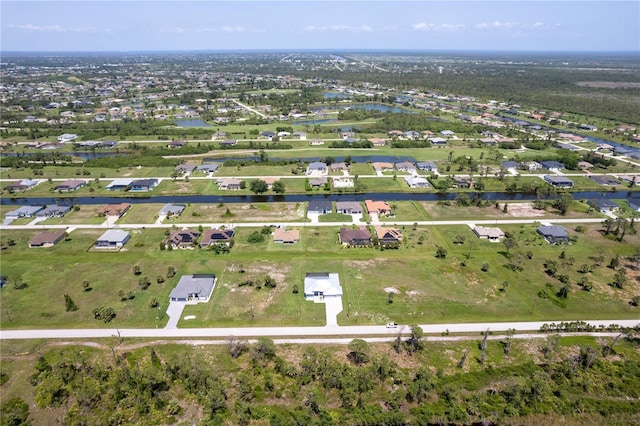 261 Rotonda Blvd S, Rotonda West, FL 33947 - aerial view of property's location with a nearby body of water and nearby suburban area