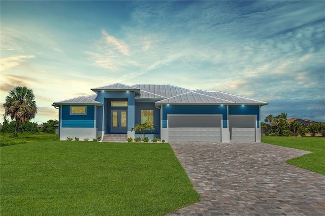 261 Rotonda Blvd S, Rotonda West, FL 33947 - view of front of house with french doors, a front yard, driveway, a garage, and a metal roof
