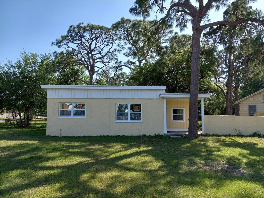 205 Lucas Rd, Merritt Island, FL 32953 - view of front of property featuring fence and a front yard