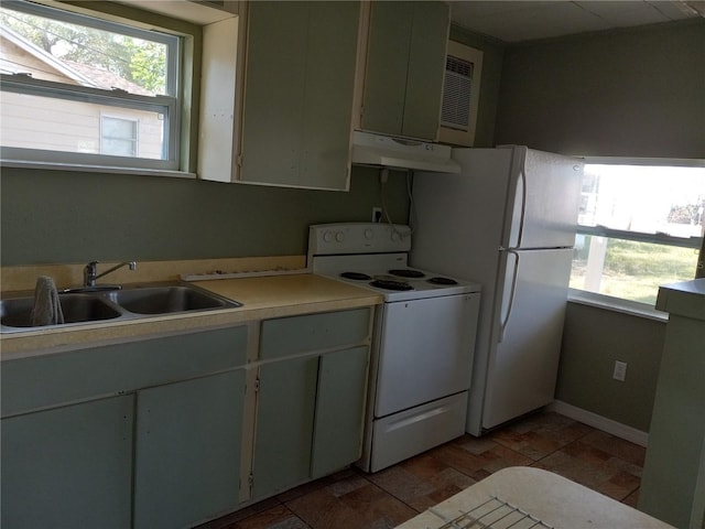 kitchen featuring a sink, under cabinet range hood, white appliances, and light countertops