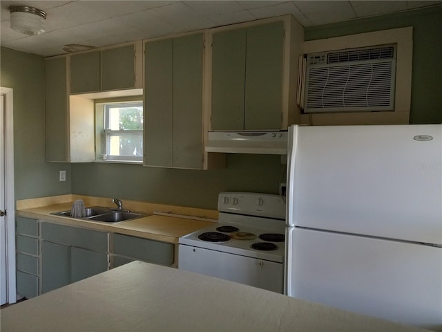 kitchen with a sink, under cabinet range hood, white appliances, and light countertops
