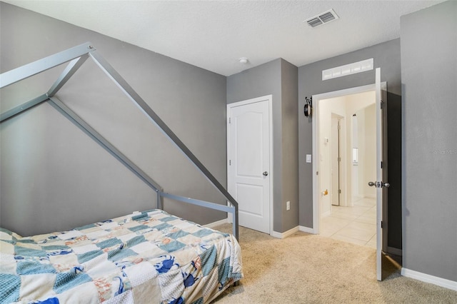 bedroom featuring light carpet and baseboards