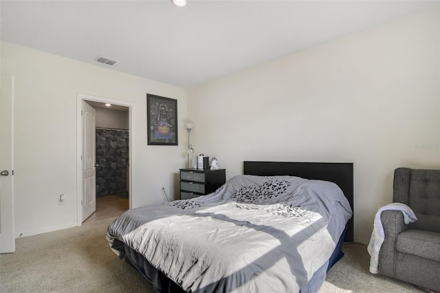 bedroom featuring light colored carpet and baseboards