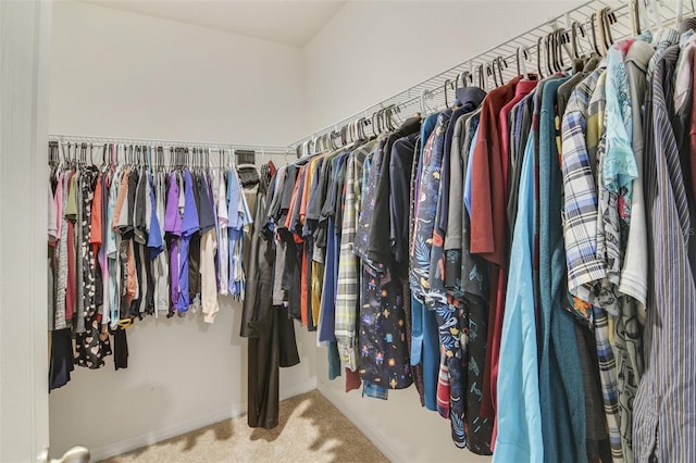walk in closet featuring carpet