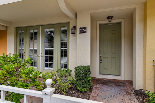 doorway to property with stucco siding