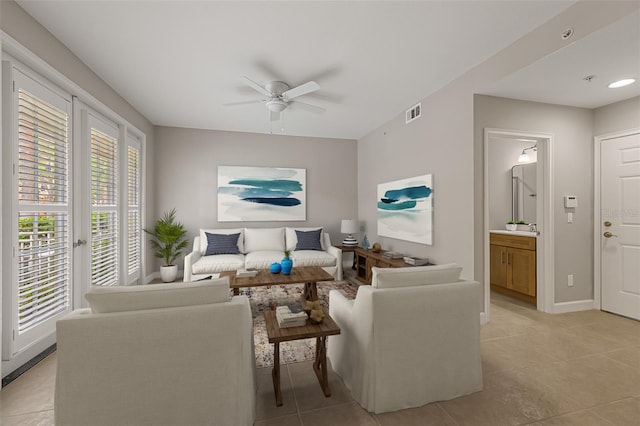living area with ceiling fan, light tile patterned floors, baseboards, and recessed lighting