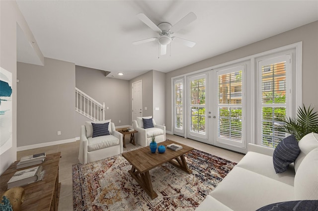tiled living area with stairway, a ceiling fan, baseboards, and recessed lighting
