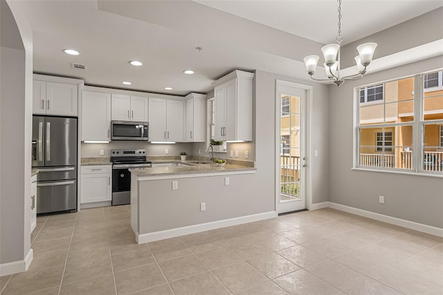 kitchen featuring stainless steel appliances, light tile patterned floors, a sink, recessed lighting, and white cabinetry