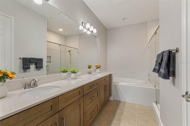 bathroom featuring a stall shower, tile patterned floors, tiled tub, and double vanity