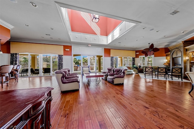 724 Greybull Run, Lake Mary, FL 32746 - living area featuring hardwood / wood-style floors and ornamental molding