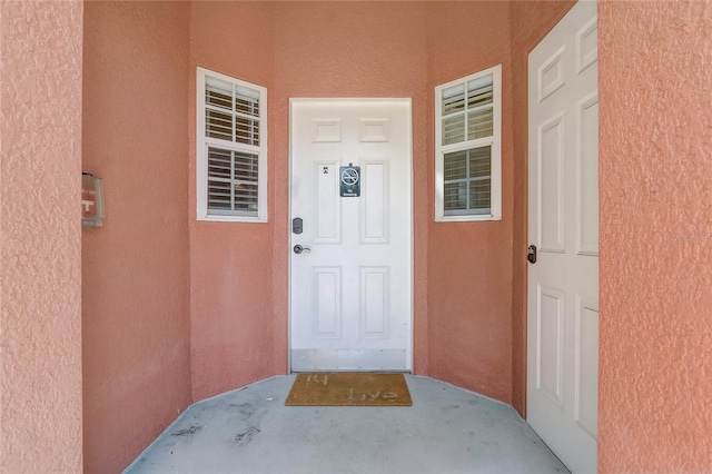1041 Park Ridge Cir, Kissimmee, FL 34746 - entrance to property featuring stucco siding and a porch