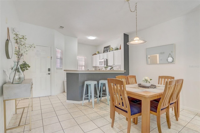 1041 Park Ridge Cir, Kissimmee, FL 34746 - dining area featuring light tile patterned floors, baseboards, and visible vents