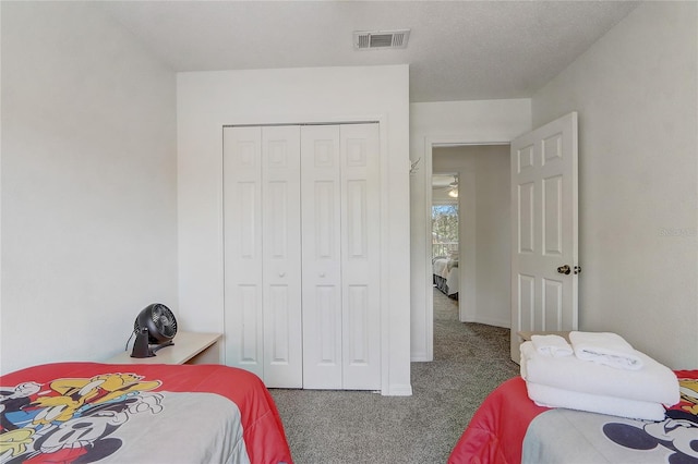 1041 Park Ridge Cir, Kissimmee, FL 34746 - carpeted bedroom with visible vents and a closet