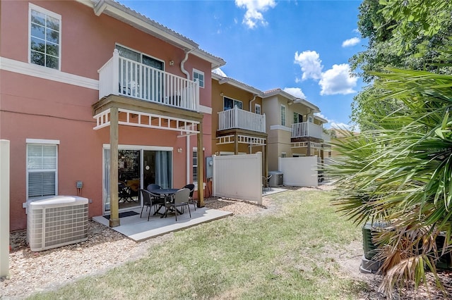 1041 Park Ridge Cir, Kissimmee, FL 34746 - back of property featuring stucco siding, cooling unit, and a tiled roof