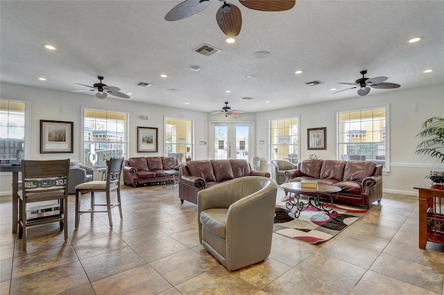 1041 Park Ridge Cir, Kissimmee, FL 34746 - tiled living room with visible vents, a ceiling fan, and recessed lighting
