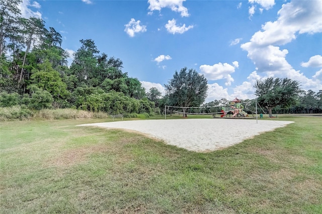 1041 Park Ridge Cir, Kissimmee, FL 34746 - view of home's community featuring a lawn, playground community, and volleyball court