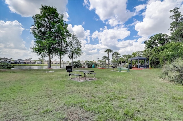 1041 Park Ridge Cir, Kissimmee, FL 34746 - surrounding community featuring a yard, a water view, and a gazebo