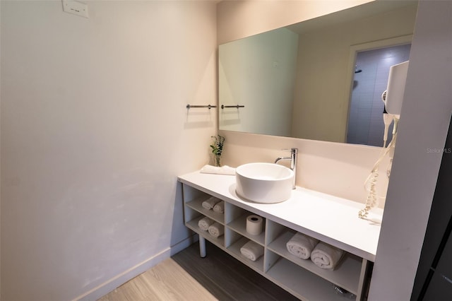 5245 W Irlo Bronson Memorial Hwy Unit 151, Kissimmee, FL 34746 - bathroom with wood finished floors, baseboards, vanity, and tiled shower