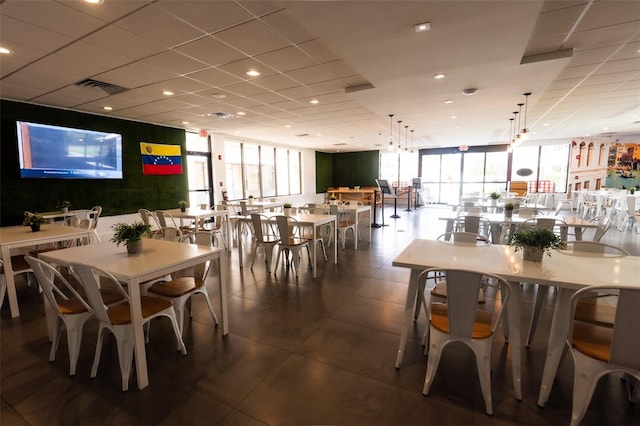 5245 W Irlo Bronson Memorial Hwy Unit 151, Kissimmee, FL 34746 - dining room with dark tile patterned floors and expansive windows