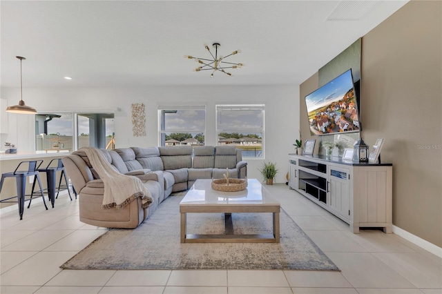 1312 Axel Graeson Ave, Kissimmee, FL 34744 - living area with light tile patterned floors, recessed lighting, and a wealth of natural light