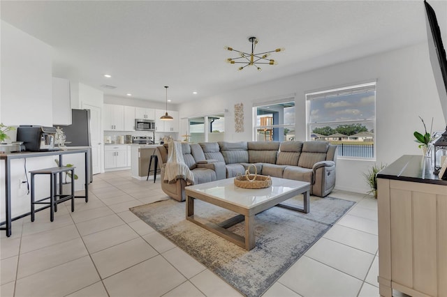 1312 Axel Graeson Ave, Kissimmee, FL 34744 - living area with an inviting chandelier, recessed lighting, and light tile patterned flooring