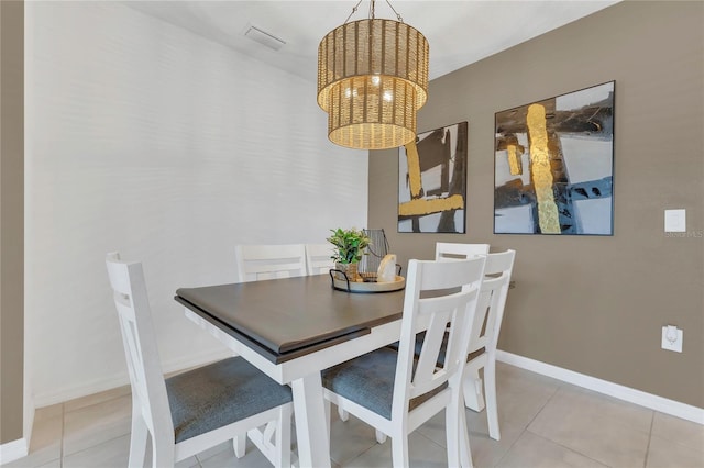 1312 Axel Graeson Ave, Kissimmee, FL 34744 - dining space featuring visible vents, baseboards, tile patterned floors, and a notable chandelier