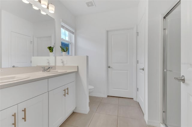 1312 Axel Graeson Ave, Kissimmee, FL 34744 - full bathroom featuring visible vents, a sink, a stall shower, and toilet