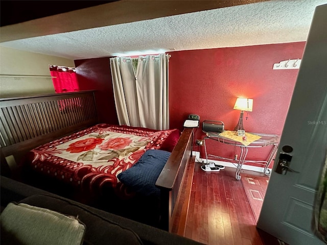 300 Broadview Ave, Altamonte Springs, FL 32701 - bedroom with hardwood / wood-style floors, a textured ceiling, and a textured wall