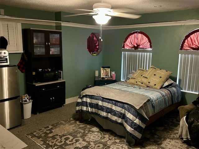 300 Broadview Ave, Altamonte Springs, FL 32701 - carpeted bedroom with freestanding refrigerator, a textured ceiling, ceiling fan, and crown molding