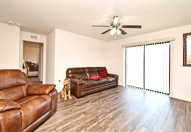 35734 Rose Moss Ave, Leesburg, FL 34788 - living room with ceiling fan, visible vents, and wood finished floors