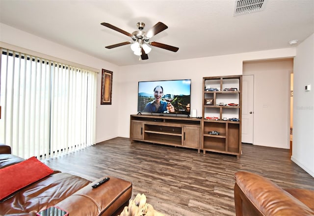 35734 Rose Moss Ave, Leesburg, FL 34788 - living area featuring baseboards, a ceiling fan, dark wood-type flooring, and visible vents
