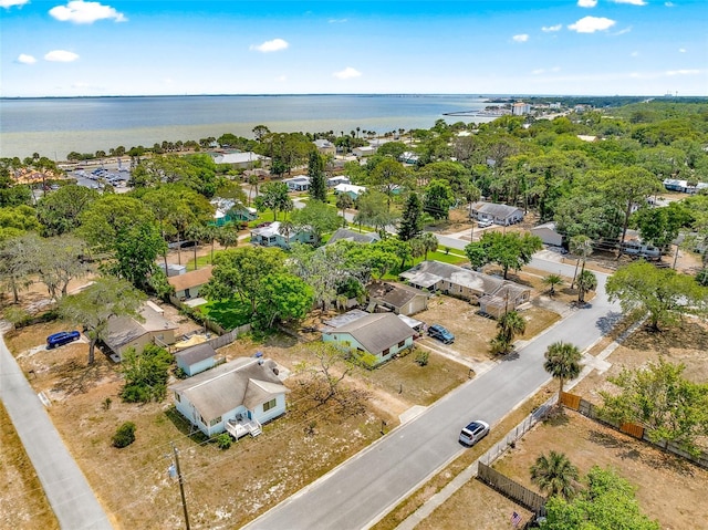 bird's eye view featuring a water view and a residential view