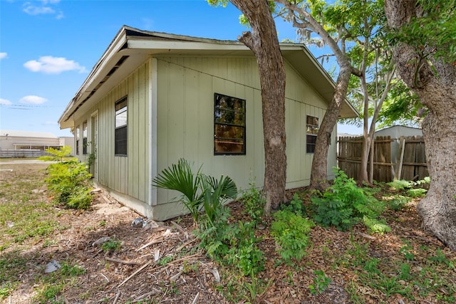 view of home's exterior featuring fence