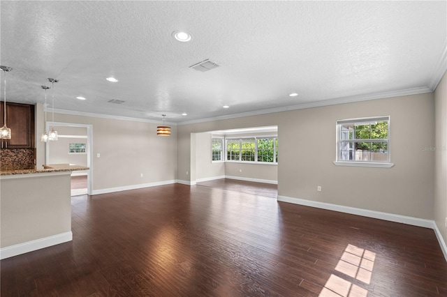 101 E Lauren Ct, Fern Park, FL 32730 - unfurnished living room with a textured ceiling, dark wood-style floors, recessed lighting, baseboards, and crown molding