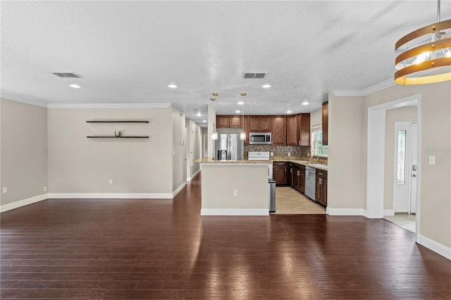 101 E Lauren Ct, Fern Park, FL 32730 - kitchen with stainless steel appliances, a center island, hardwood / wood-style flooring, a sink, and open floor plan