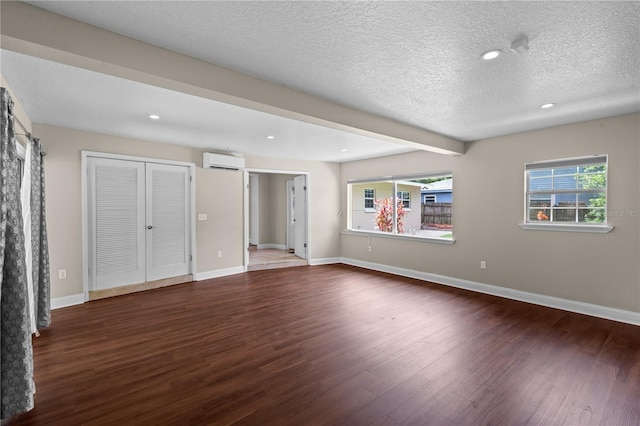 101 E Lauren Ct, Fern Park, FL 32730 - unfurnished bedroom with a wall mounted air conditioner, wood finished floors, multiple windows, recessed lighting, and baseboards