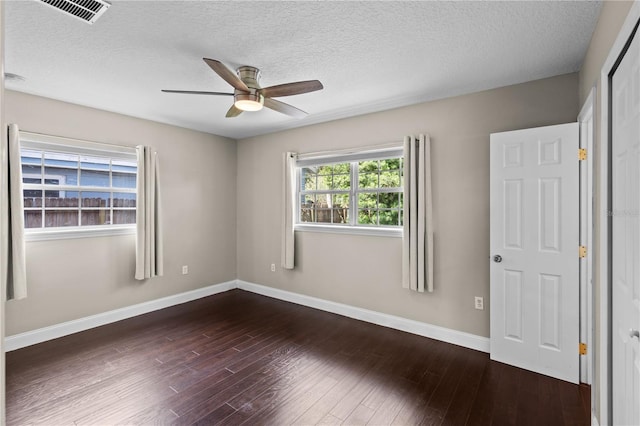 101 E Lauren Ct, Fern Park, FL 32730 - spare room with a ceiling fan, baseboards, dark wood finished floors, and a textured ceiling