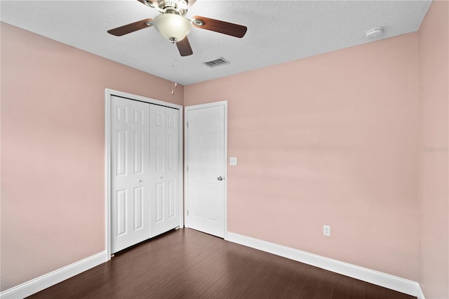 101 E Lauren Ct, Fern Park, FL 32730 - unfurnished bedroom featuring baseboards, dark wood-style flooring, and a closet