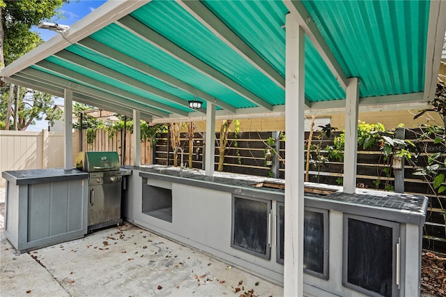 101 E Lauren Ct, Fern Park, FL 32730 - view of patio with exterior kitchen, fence, a sink, and grilling area