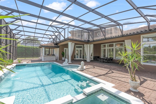 1450 Belfiore Way, Windermere, FL 34786 - view of swimming pool with a pool with connected hot tub, a patio, and french doors