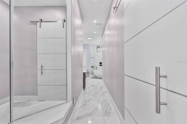 1450 Belfiore Way, Windermere, FL 34786 - hallway featuring light marble finish flooring and recessed lighting