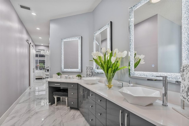 1450 Belfiore Way, Windermere, FL 34786 - ensuite bathroom with marble tiled flooring, double vanity, and recessed lighting